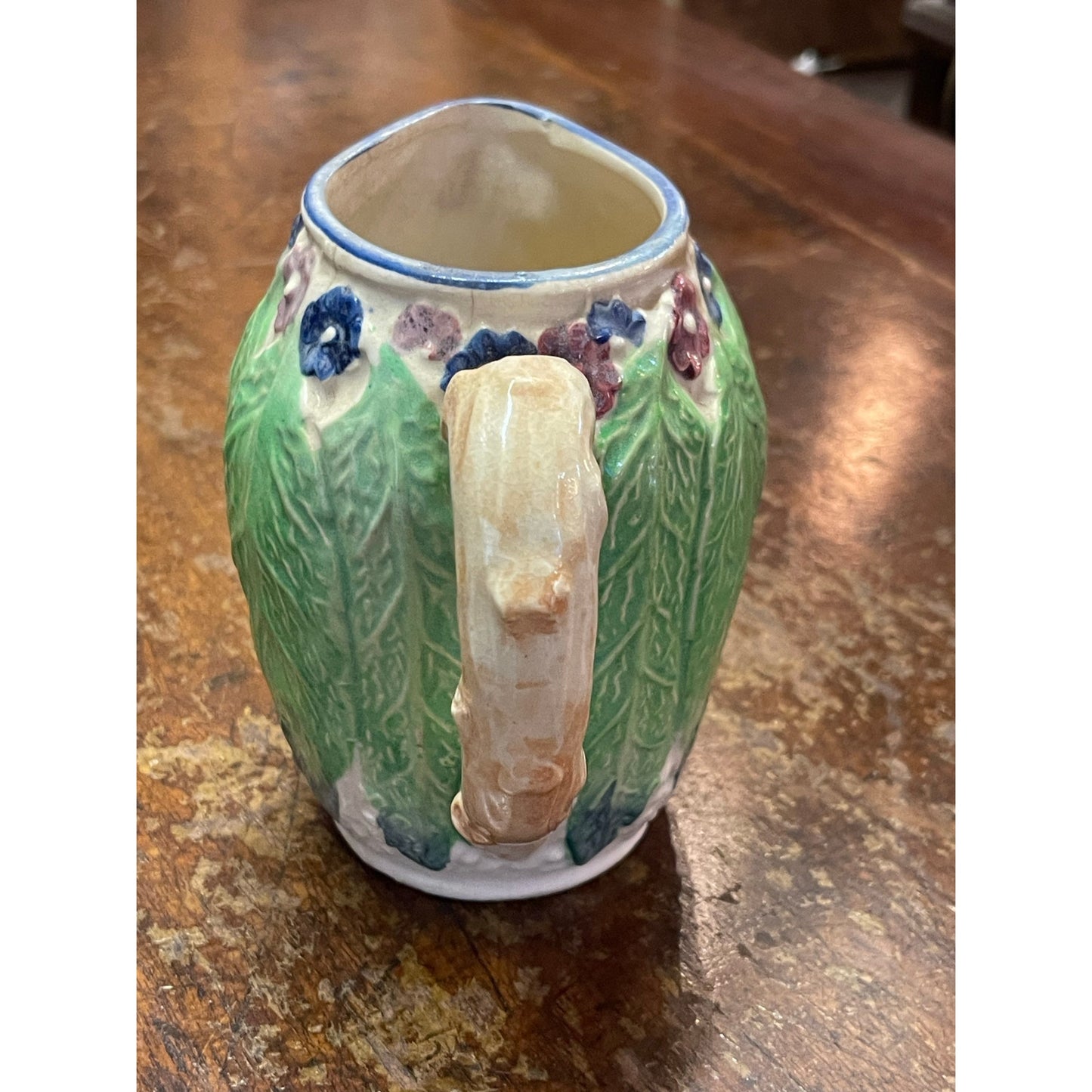 Vintage Majolica Japan hand-painted floral and leaf handled small pitcher
