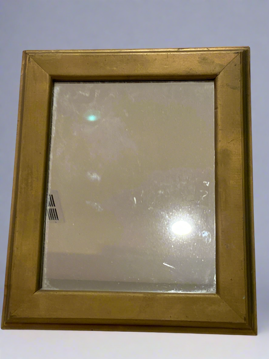 Gold colored wooden frame mirror