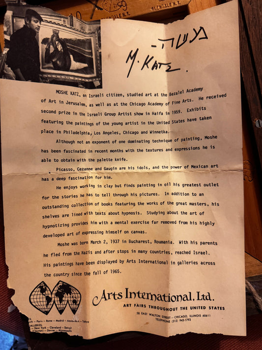 Vintage letter with text and a signature on a wooden surface