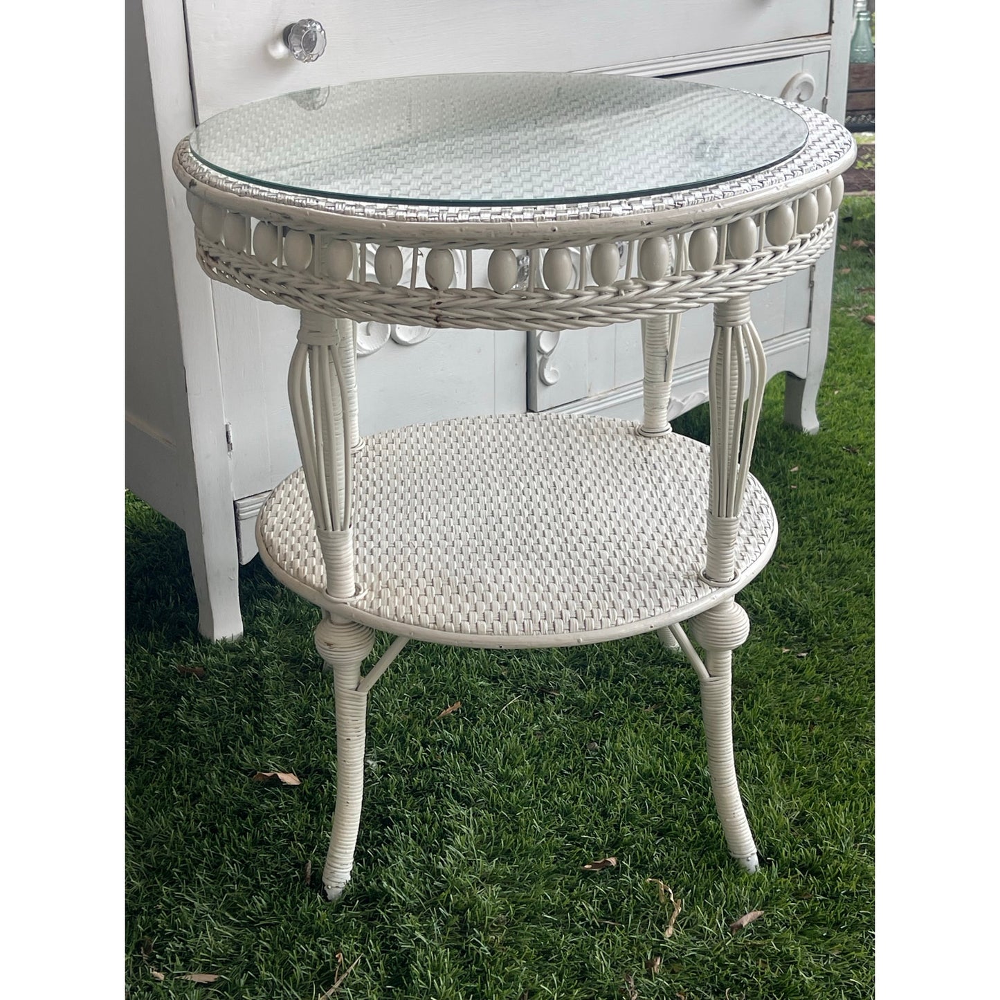 Vintage glass top wicker side table