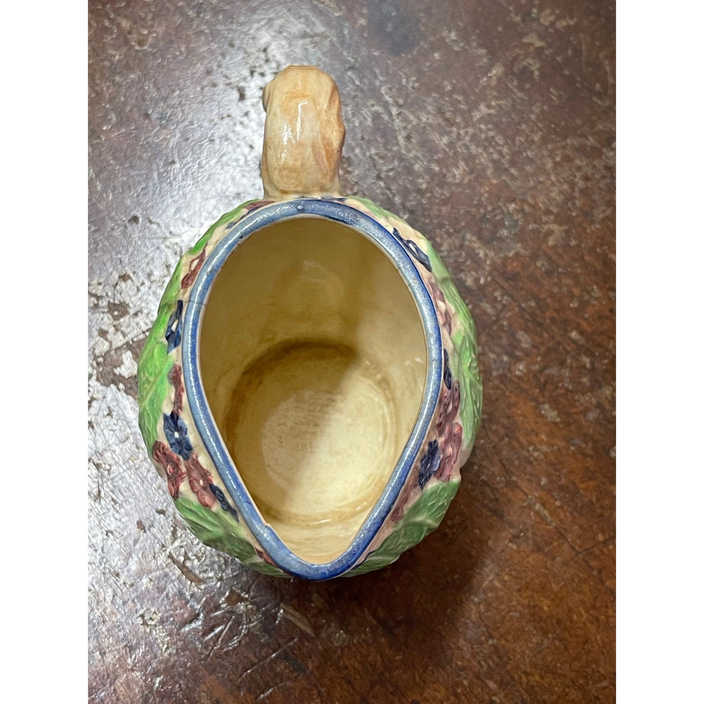 Vintage Majolica Japan hand-painted floral and leaf handled small pitcher