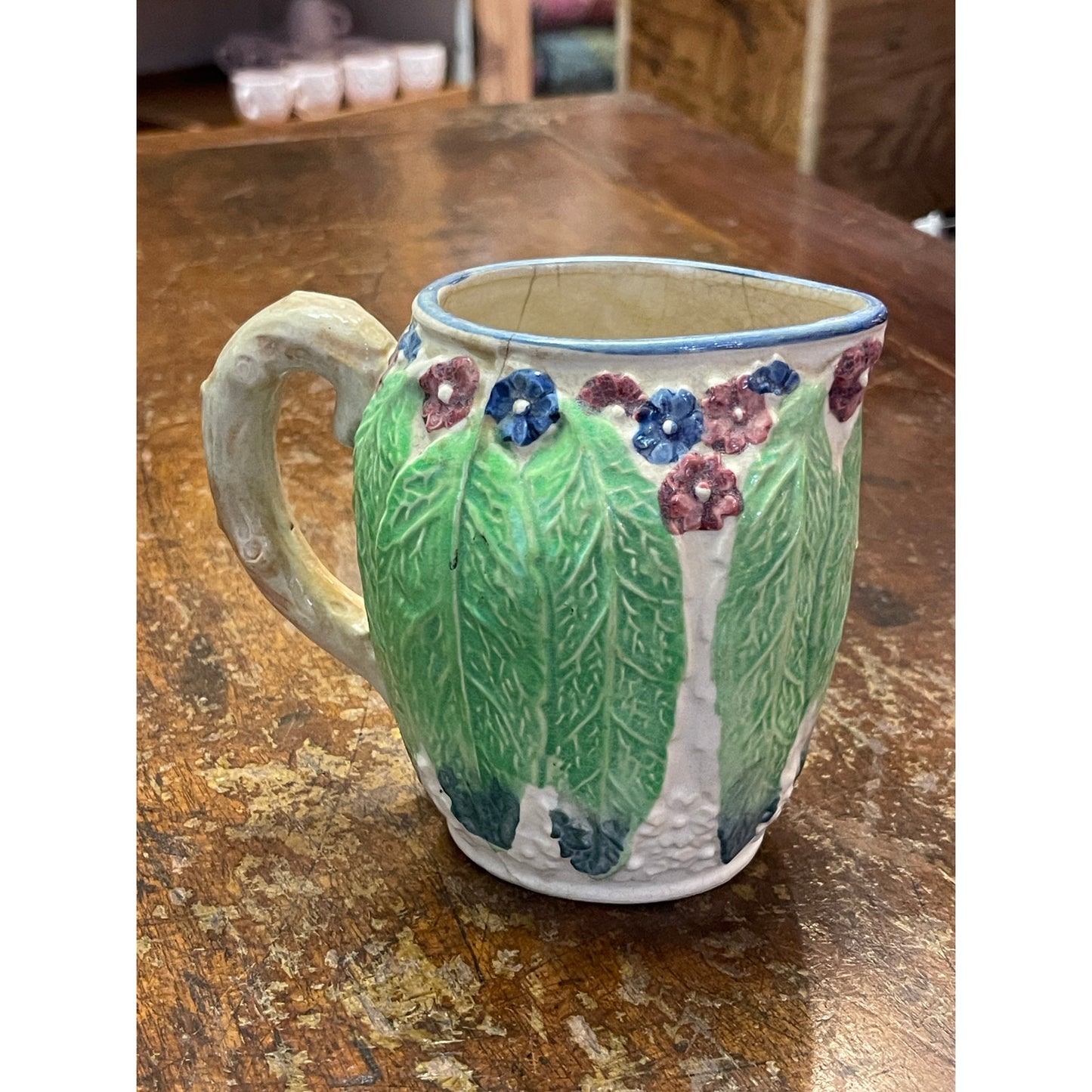 Vintage Majolica Japan hand-painted floral and leaf handled small pitcher