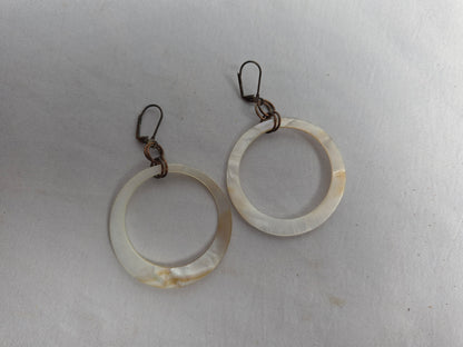 NATURAL shell donut suspended by brass earrings CSHW