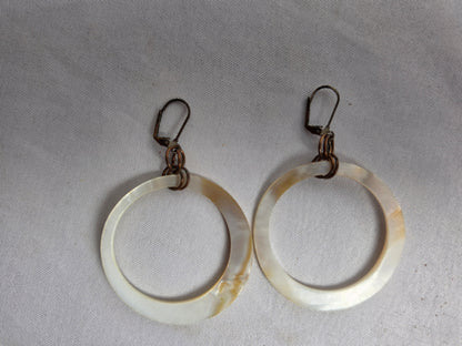 NATURAL shell donut suspended by brass earrings CSHW