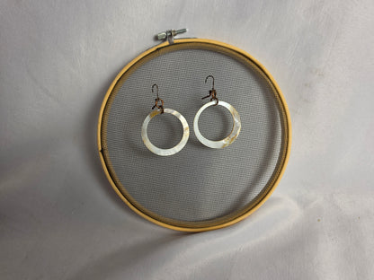 NATURAL shell donut suspended by brass earrings CSHW