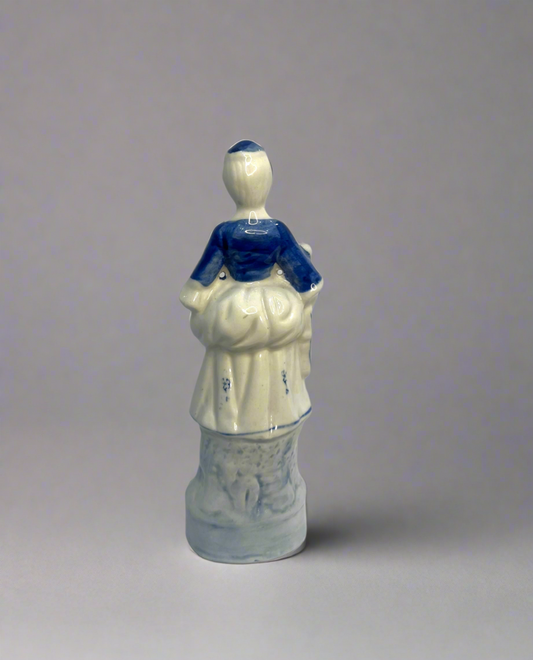 A Chinoiserie Blue And White Ceramic Chintz Figurine Peasant Woman
