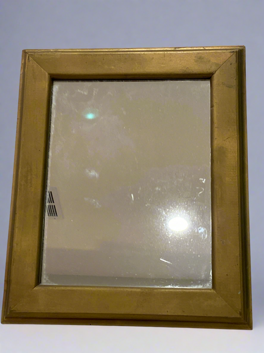 Gold colored wooden frame mirror